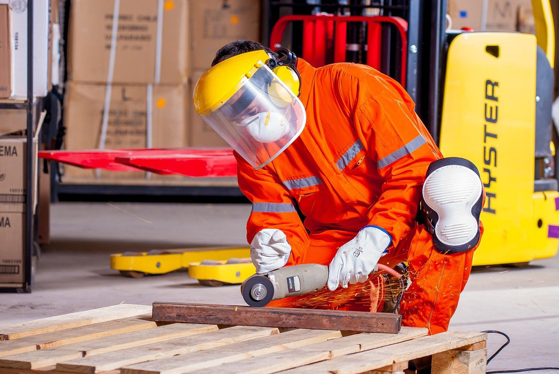 Worker Operating Machinery in Safety Gear